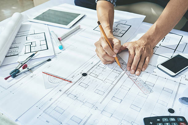 Drawing blueprint Close-up image of engineerr drawing blueprint architect office stock pictures, royalty-free photos & images