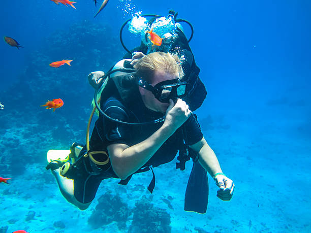 istock Learning to breath under water. Diving in Egypt 629691176