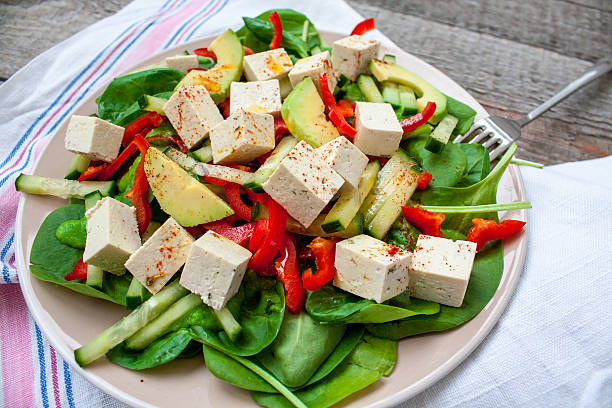 istock Green vegan salad with spinach and tofu 629693838