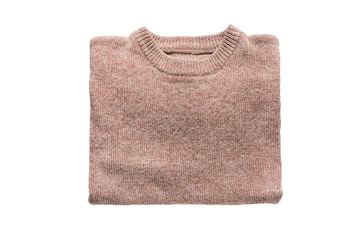 Beige cashmere pullover folded on white background
