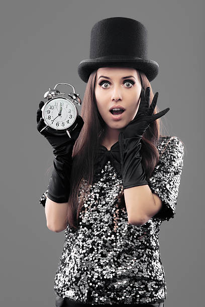 istock Surprised Woman with Alarm Clock on New Year 629694444