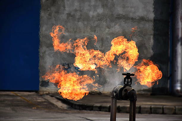On fire with gas leak from pipe and valv. On fire with gas leak from pipe and valv. air valve photos stock pictures, royalty-free photos & images