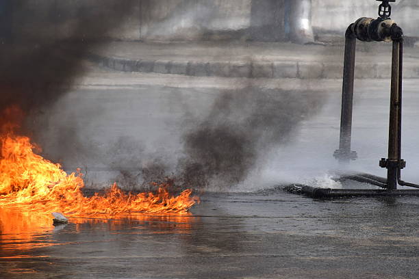 fire fighting with fire extingguishers and fire hose. - clock time alarm clock urgency imagens e fotografias de stock