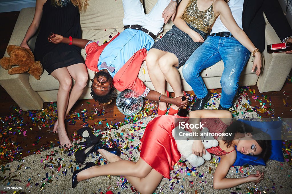 Exhaustion Drunk and tired people sleeping after party Party - Social Event Stock Photo