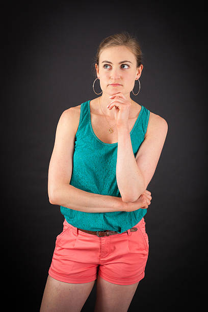 istock Beautiful woman doing different expressions in different sets of clothes: thinking 629712422