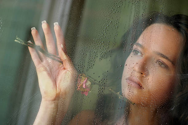 istock The girl behind glass 629721236