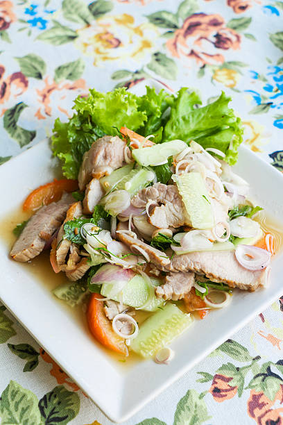 istock spicy fruit and vegetable salad with grilled pork 629721350