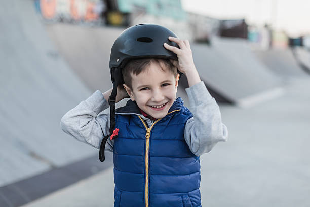 istock Boy adjusting his safety helmet 629723376