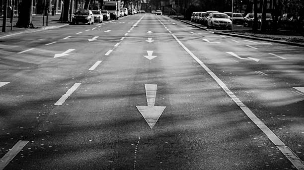 istock High Angle View Of Arrow Symbols On Road 629723467