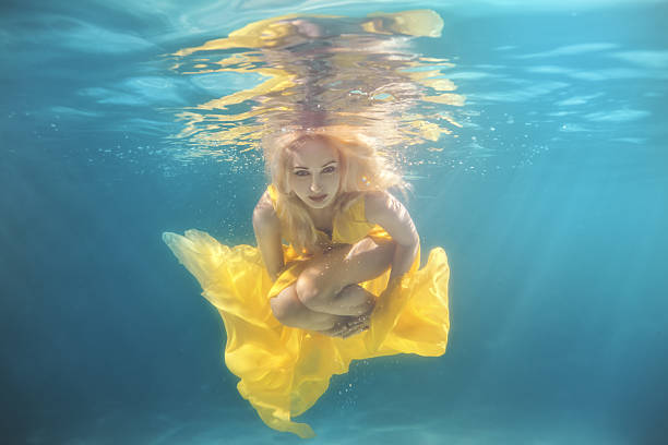 istock The pool woman swims underwater. 629724458