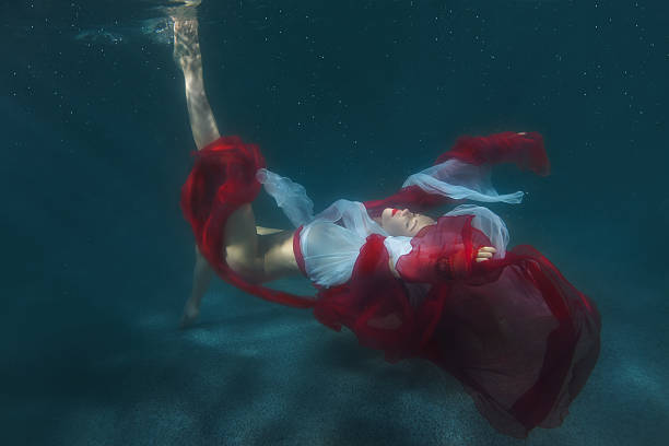 istock Dancing woman underwater. 629725396