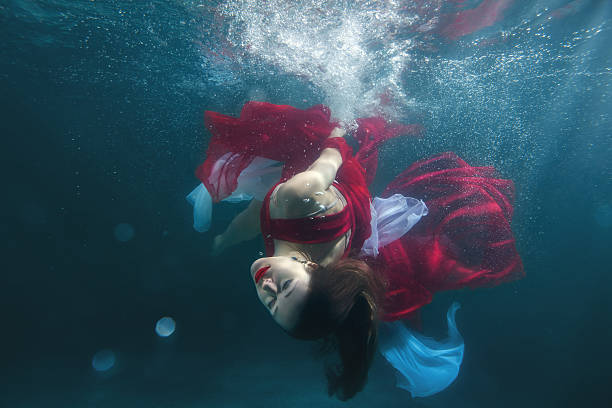 istock In the pool underwater dancing girl. 629725514