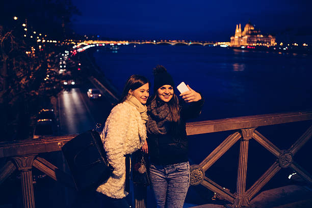 istock sisters taking selfie in Budapest 629725650