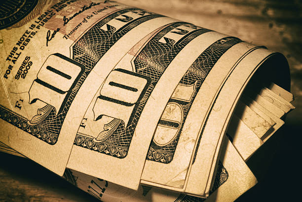 istock dollar bills tied with rubber band 629725746