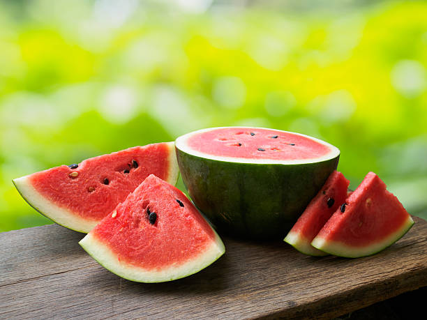 istock Fresh watermelon fruit on wooden table 629726112