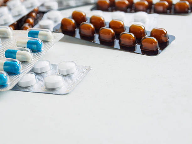 istock packing medicine pill and capsule on white background 629726146