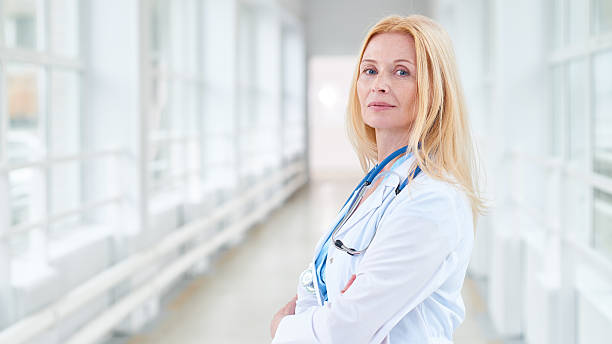 istock Confident blond doctor in clinic 629726744