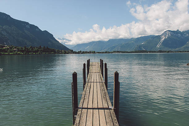 istock Pier Over Lake By Mountains Against Sky 629729195