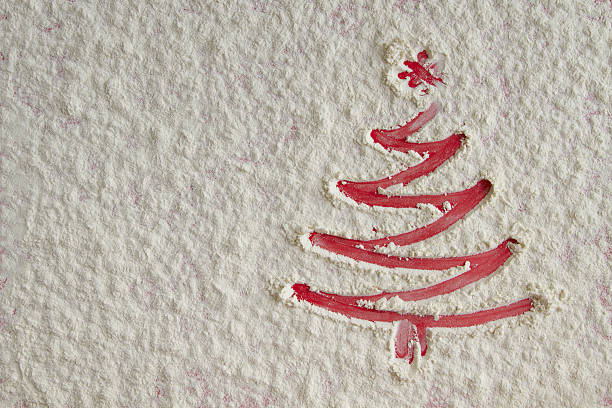 istock Christmas tree on flour background. White flour looks like snow. 629729852