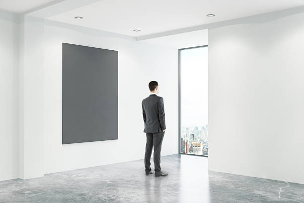 istock Businessman in office with blackboard 629732646