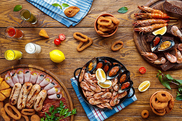 istock Seafood platter top view, flat lay on wooden table background 629734664