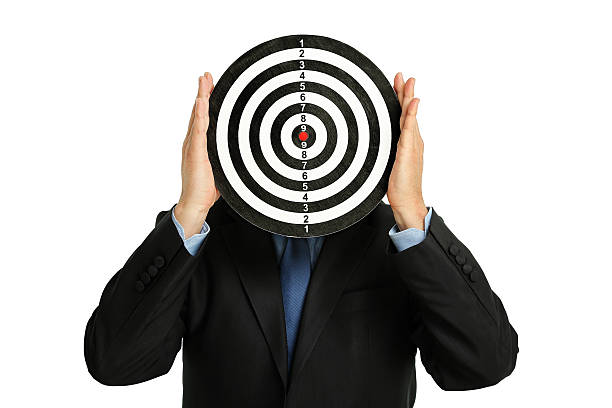 istock businessman with dartboard 629734898