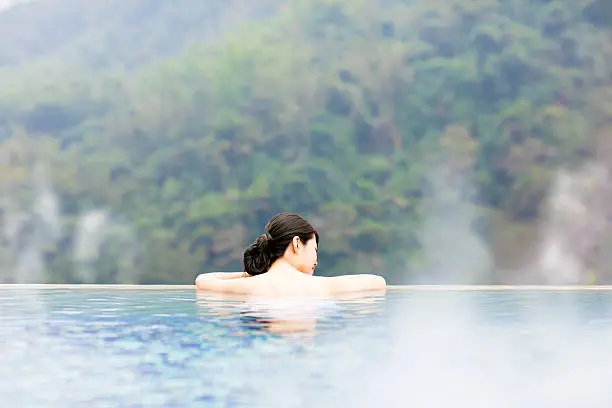 young woman relaxing in  hot springs