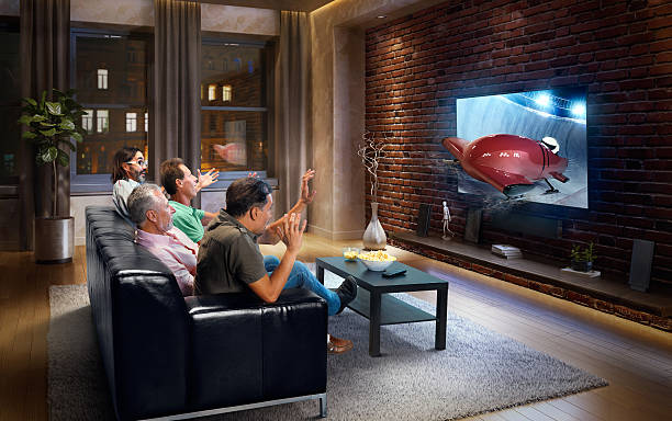 istock Adults watching Bobsleigh race at home 629735326