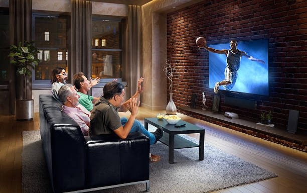 istock Adults watching very realistic Basketball game at home 629735604