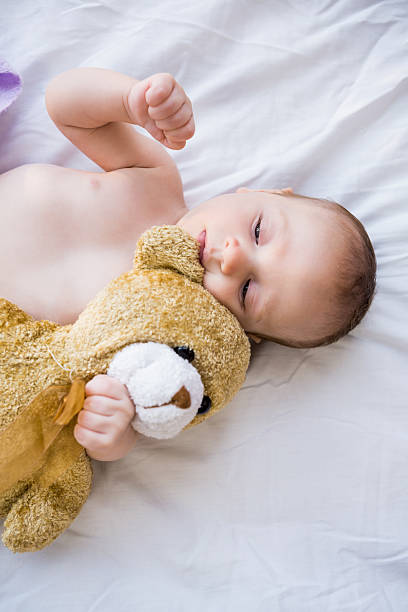 istock Baby lying on baby bed 629736768