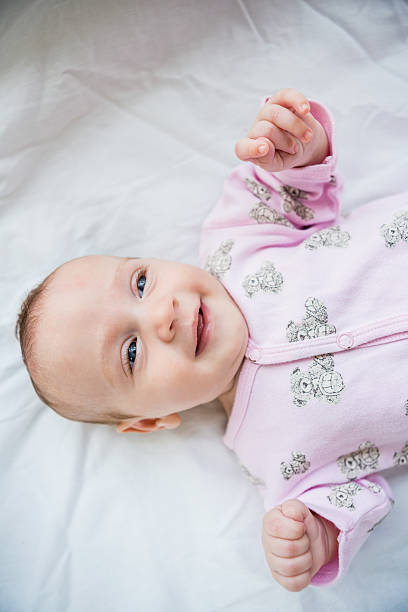 istock Cute baby boy relaxing on bed 629737522