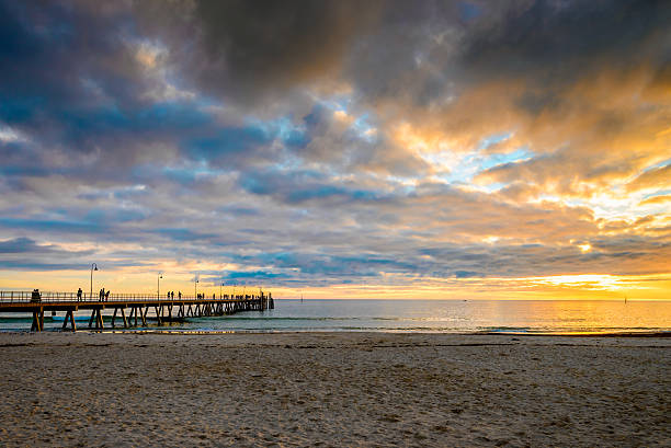 istock People on Glenelg Beach jetty 629737812