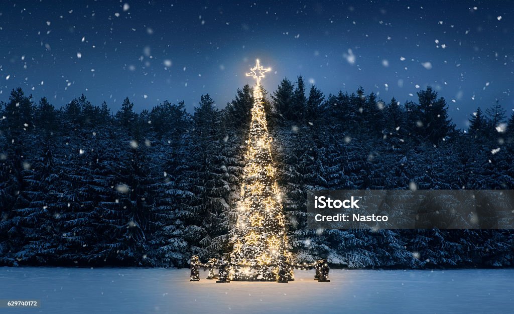 Christmas tree at night Illuminated christmas tree at night with falling snow and copy space Christmas Stock Photo