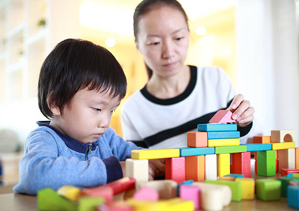 istock Cute asian Children playing with blocks 629740482