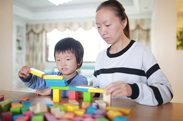 istock Cute asian Children playing with blocks 629740486