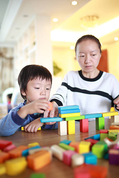 istock Cute asian Children playing with blocks 629740552