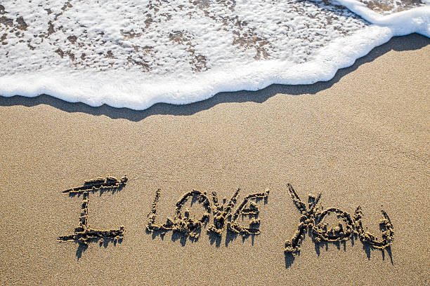 istock Love sculpted in the sand 629740988