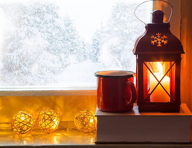 istock Winter windowsill decor with lantern, book and hot chocolate or 629743758
