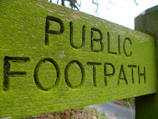 istock Weathered old carved wooden 'Public Footpath' sign 629744288