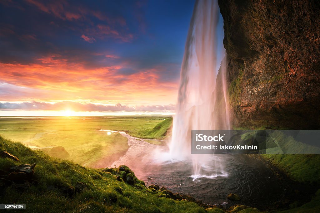 Seljalandsfoss waterfall at sunset, Iceland Seljalandsfoss Waterfall Stock Photo