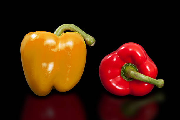 Paprika on pure black background.