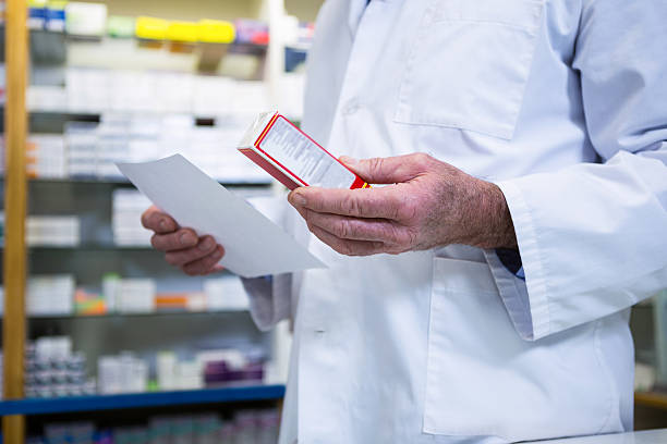 istock Pharmacist holding a prescription and medicine 629757210