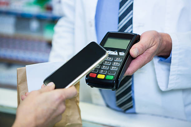 istock Customer making payment through smartphone in payment terminal 629757922