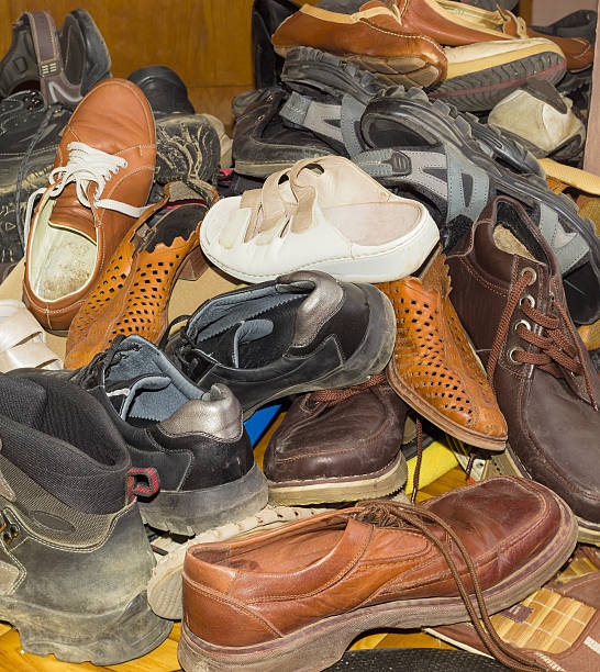istock Pile of old different worn footwear 629760204