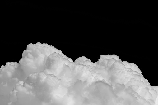 Closeup cumulus cloud isolated on black background
