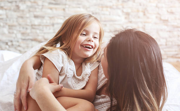 istock Mother and daughter enjoy in bed. 629761820