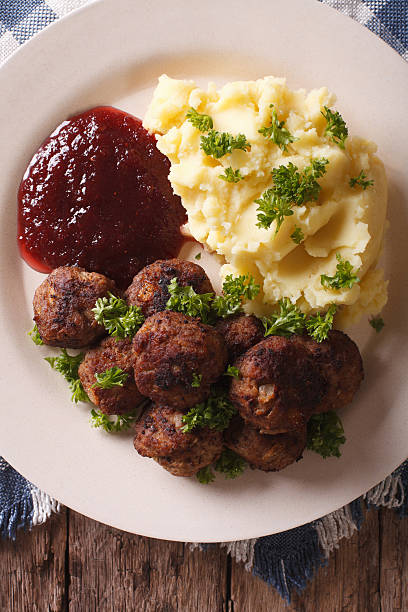istock Swedish cuisine: meatballs, lingonberry sauce, potato closeup 629762282