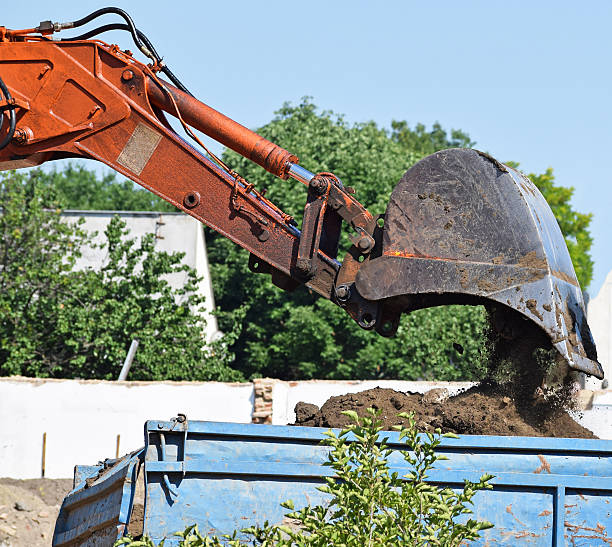 istock Excavator loads a truck 629762538