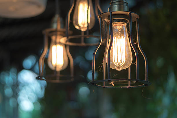 istock beautiful Light bulb incandescent hanging decorated interior roo 629763096