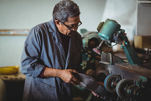 istock Shoemaker polishing a shoe with machine 629764052